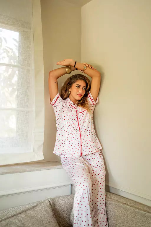 White PJ with red dots