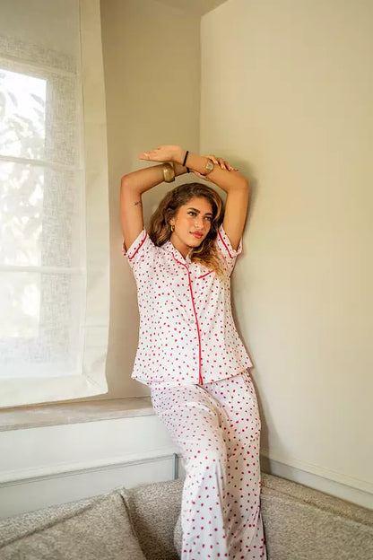 White PJ with red dots